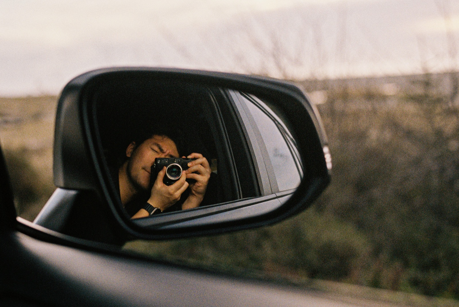 Self-portrait in side mirror